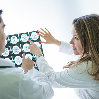 Doctors examining MRI scan